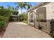 View of the house with beautiful landscaping, a backyard pergola and fenced in yard at 4109 Riverview Blvd, Bradenton, FL 34209