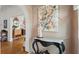 Charming foyer featuring beautiful artwork and an arched entryway to the dining area at 4109 Riverview Blvd, Bradenton, FL 34209