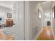 Hallway view showcasing hardwood floors and access to a bedroom and bathroom at 4109 Riverview Blvd, Bradenton, FL 34209
