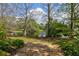 Beautiful backyard view showing lush landscaping and lake views with stepping stones and serene views at 4178 Central Sarasota Pkwy # 325, Sarasota, FL 34238