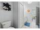 Bright bathroom with a vanity, toilet, and an adjacent bedroom view at 4178 Central Sarasota Pkwy # 325, Sarasota, FL 34238