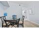 Quaint dining area features a glass-top table with seating and direct access to a bathroom with a nearby mirror at 4178 Central Sarasota Pkwy # 325, Sarasota, FL 34238