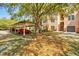 Exterior of condo shows garages, carports and lush green landscaping throughout at 4178 Central Sarasota Pkwy # 325, Sarasota, FL 34238