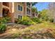 Exterior of condo with lush landscaping and balconies, situated on a beautiful day at 4178 Central Sarasota Pkwy # 325, Sarasota, FL 34238