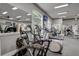 Bright gym with cardio machines, treadmills, and large windows for a natural light setting at 4178 Central Sarasota Pkwy # 325, Sarasota, FL 34238