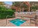 Hot tub with easy access, privacy landscaping, and a nearby seating area at 4178 Central Sarasota Pkwy # 325, Sarasota, FL 34238