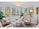 Bright sunroom with large windows providing ample natural light and comfortable seating at 4178 Central Sarasota Pkwy # 325, Sarasota, FL 34238