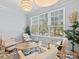 Bright sunroom with a chandelier, large windows for natural light, and comfortable seating at 4178 Central Sarasota Pkwy # 325, Sarasota, FL 34238
