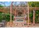 Picturesque trellis with a small water feature, seating and green landscaping at 4178 Central Sarasota Pkwy # 325, Sarasota, FL 34238