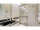 Well-lit bathroom with a single sink with granite countertop, tiled floors and a glass-enclosed shower at 4181 Brittany Ln # 25, Sarasota, FL 34233