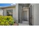 Inviting screened front entryway with tile flooring, leading to a well-lit and secure home at 4181 Brittany Ln # 25, Sarasota, FL 34233
