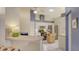 Bright kitchen featuring white cabinets, stainless steel appliances, and ample counter space at 4181 Brittany Ln # 25, Sarasota, FL 34233