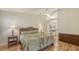 Comfortable main bedroom featuring wood-look flooring, a ceiling fan and ensuite bathroom at 4181 Brittany Ln # 25, Sarasota, FL 34233
