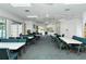 Spacious recreation room offers a comfortable setting with ample seating and natural light at 4181 Brittany Ln # 25, Sarasota, FL 34233