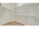 Spacious walk-in closet with wooden floor and shelving with ample storage space at 4181 Brittany Ln # 25, Sarasota, FL 34233