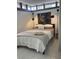 Comfortable bedroom with soft lighting and neutral decor, perfect for relaxation at 4408 Midnight Pass Rd, Sarasota, FL 34242