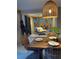 Bright dining area with woven chairs, wooden table, and modern decor at 4408 Midnight Pass Rd, Sarasota, FL 34242