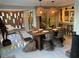 Elegant dining area with a rustic table, woven chairs, and modern decor at 4408 Midnight Pass Rd, Sarasota, FL 34242