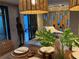Stylish dining area with unique decorations, natural light and outdoor view at 4408 Midnight Pass Rd, Sarasota, FL 34242