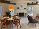 Dining room with modern furnishings and an adjacent seating area with natural light at 4408 Midnight Pass Rd, Sarasota, FL 34242