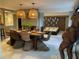 Inviting dining room with a wooden table, woven chairs, and pendant lighting at 4408 Midnight Pass Rd, Sarasota, FL 34242