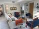 Bright living room featuring modern decor, white tile flooring, and an open floor plan at 4408 Midnight Pass Rd, Sarasota, FL 34242