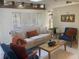 Bright living room with a skylight, and modern furnishings at 4408 Midnight Pass Rd, Sarasota, FL 34242