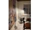 Cozy sitting area with a modern chair and a large art piece at 4408 Midnight Pass Rd, Sarasota, FL 34242