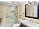 Clean bathroom featuring a glass-enclosed shower, modern vanity, and neutral color palette at 4632 Ringwood Mdw # 28, Sarasota, FL 34235