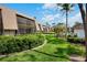 Condominium building with landscaped green space and community pool at 4632 Ringwood Mdw # 28, Sarasota, FL 34235