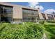 Condominium building with screened patios and lush landscaping at 4632 Ringwood Mdw # 28, Sarasota, FL 34235