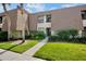 Charming condo with lush landscaping, a well-maintained lawn, and beautiful flowering shrubs at 4632 Ringwood Mdw # 28, Sarasota, FL 34235