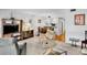 Inviting living room adjacent to the dining area, featuring a comfortable recliner and plush seating at 4632 Ringwood Mdw # 28, Sarasota, FL 34235