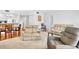 Spacious living room with a dining area and comfortable seating at 4632 Ringwood Mdw # 28, Sarasota, FL 34235