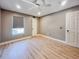 Bedroom featuring wood-look floors, a ceiling fan, and a window with blinds at 4850 51St W St # 4205, Bradenton, FL 34210