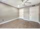 Neutral bedroom with wood-look floors and white trim at 4850 51St W St # 4205, Bradenton, FL 34210