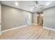 Spacious bedroom featuring wood-look floors and a ceiling fan at 4850 51St W St # 4205, Bradenton, FL 34210