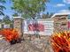 Decorative community sign with stone accents and vibrant landscaping at 4850 51St W St # 4205, Bradenton, FL 34210