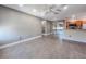 Open-concept living room with modern floors and a partial view of the kitchen at 4850 51St W St # 4205, Bradenton, FL 34210