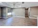Open living room with wood-look floors and plenty of natural light at 4850 51St W St # 4205, Bradenton, FL 34210