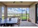 Screened patio overlooking the pond providing shade and outdoor dining space at 4984 Seafoam Trl, Bradenton, FL 34211