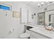 Bright and clean bathroom featuring a white vanity, toilet, and glass-enclosed shower at 5055 Gulf Of Mexico Dr # 115, Longboat Key, FL 34228
