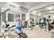 Spacious gym with natural light featuring a variety of exercise machines and equipment at 5055 Gulf Of Mexico Dr # 115, Longboat Key, FL 34228