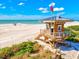 Picturesque lifeguard stand on white sand beach at 5055 Gulf Of Mexico Dr # 115, Longboat Key, FL 34228