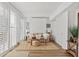 Stylish living room with shuttered windows, neutral furnishings, and wood-look floors creates a relaxing atmosphere at 5055 Gulf Of Mexico Dr # 115, Longboat Key, FL 34228