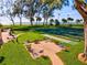 Relaxing patio area with ocean views and a beautiful tennis court at 5055 Gulf Of Mexico Dr # 115, Longboat Key, FL 34228
