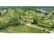 Elevated view of the well-maintained golf course and serene landscaping with walking paths, and water features at 515 Spring Lakes Blvd # 515, Bradenton, FL 34210