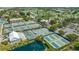 Aerial view of tennis courts and green spaces, providing a glimpse of recreational opportunities and a tranquil environment at 515 Spring Lakes Blvd # 515, Bradenton, FL 34210