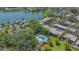 An attractive waterfront property boasts a pool, mature trees, and convenient parking at 515 Spring Lakes Blvd # 515, Bradenton, FL 34210