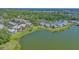 A tranquil waterfront property features lush green lawns and a serene lake view at 515 Spring Lakes Blvd # 515, Bradenton, FL 34210